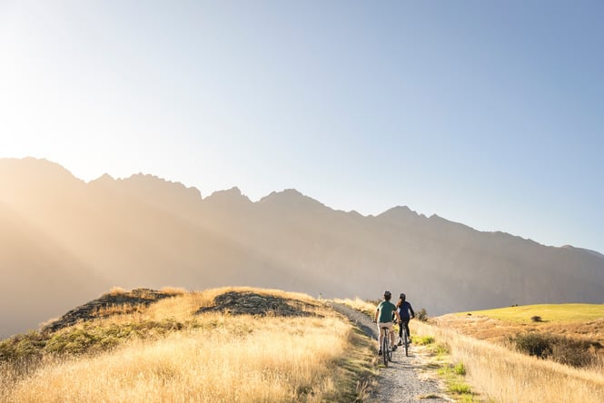 People biking Coronet Peak.