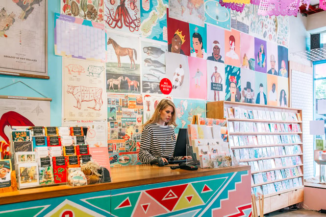 A woman working behind the counter at Iko Iko.