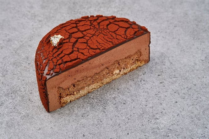 Half a chocolate cake on a table.