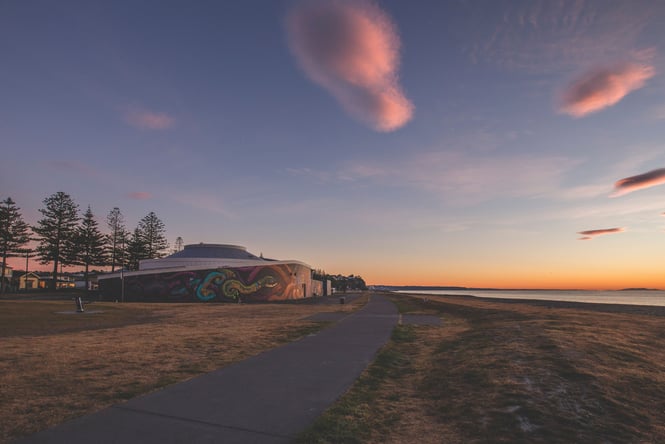 The sun setting over the National Aquarium.