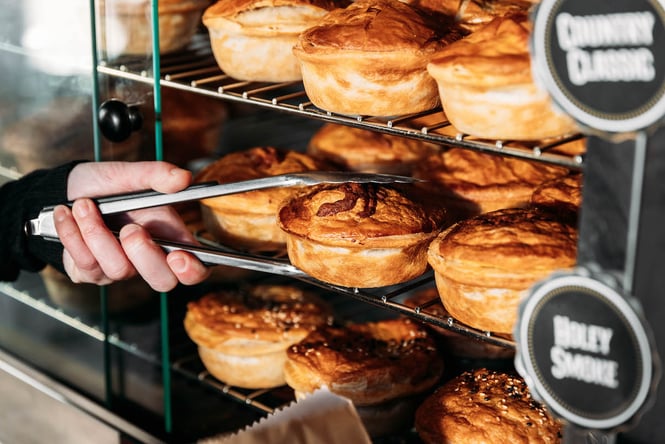 A cabinet full of Sanga's Pies in Cromwell