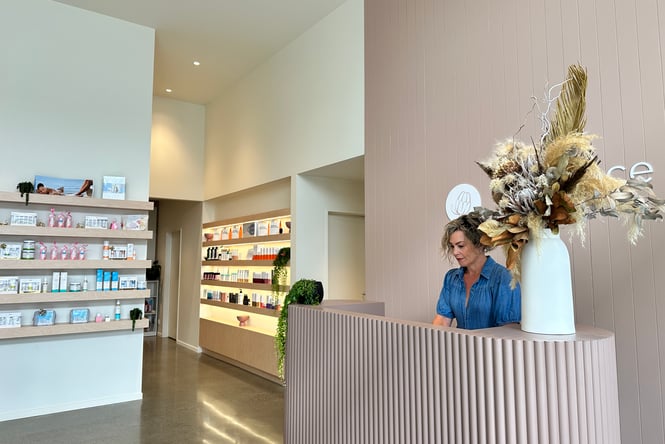 A staff member working at the counter at Embrace Skin and Beauty in Rolleston.