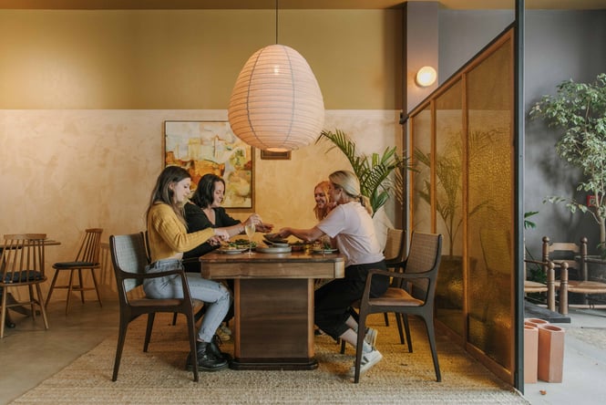 A group of women dining around a table.