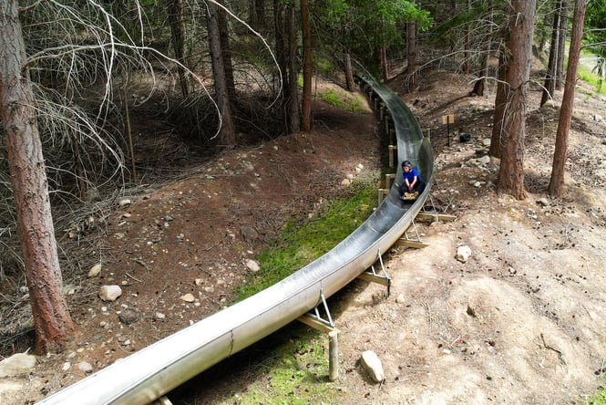 Kid going down the Gold Rush Luge at Maniototo Adventure Park