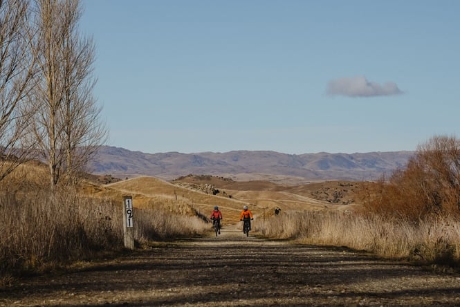 People biking on a track.