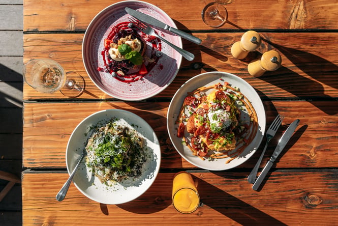 Three plates of food on a table.