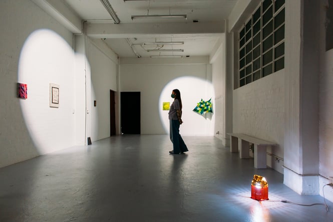 A person looking at art inside Play Station.