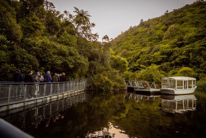 A group of people on a bridge.
