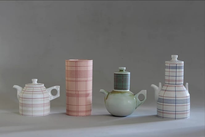 Tall vases and jugs on a table.