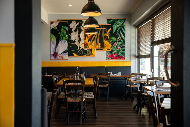 The blue and black interior of Krung Thep Thai Street Food in Ashburton.