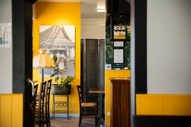 The blue and black interior of Krung Thep Thai Street Food in Ashburton.