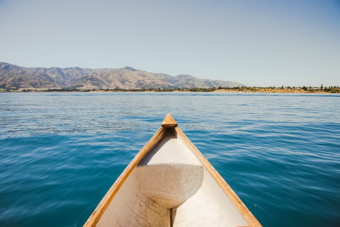 The tip of a canoe on Lake Hawea.