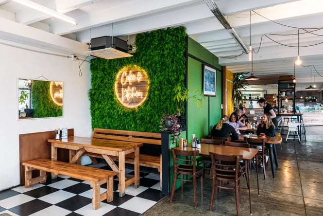 The green, black and white interior of Cake & Kitchen.