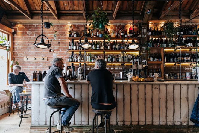 Customers sitting at the bar inside Civil and Naval in Lyttelton.