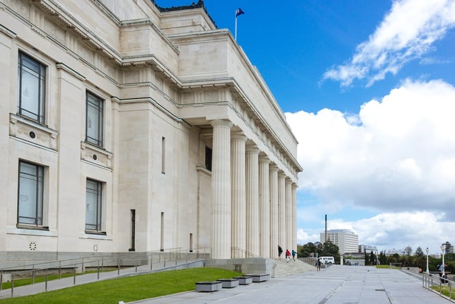 Exterior of Auckland Museum, a grand white building surrounded by green park