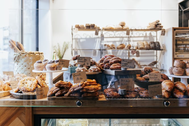 Plates full of pastries on display at the Bohemian Bakery counter.