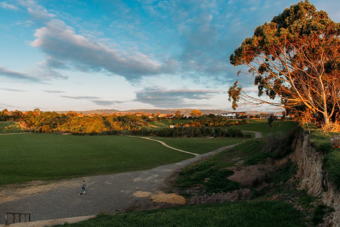 The sun setting over Edward Pit Park Reserve on a clear day.