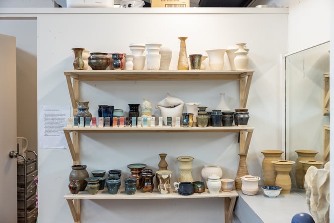 Shelf of locally made ceramics at Pottery Capital in New Brighton