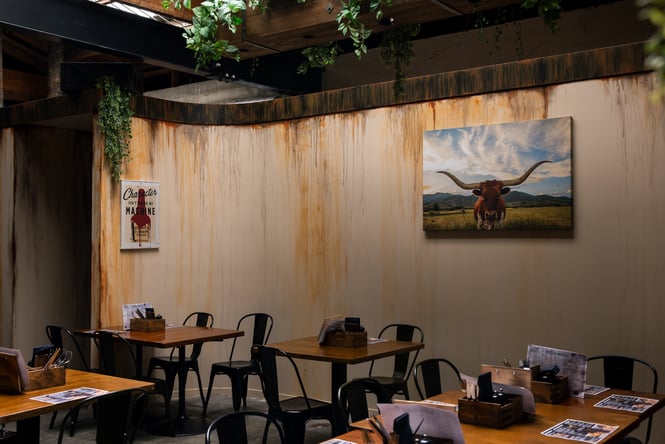 Tables and chairs inside the dining room at Smoke in Ashburton.