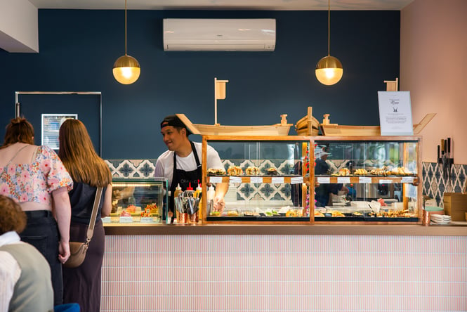 A staff member serving customers at The Rabbit in Ashburton.