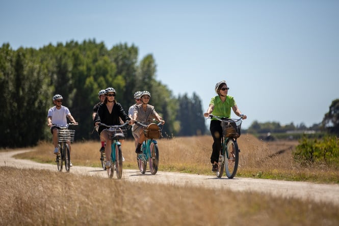 People riding bikes along a track.