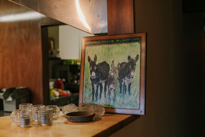 Three Donkeys in a painting.