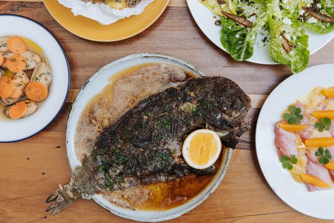 Cooked fish on a plate at Gatherings.
