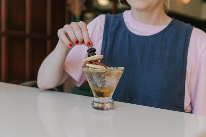 Customer enjoying a cocktail at Miro.