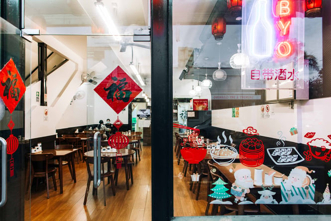 A view of the inside of the New Flavour restaurant from the street.