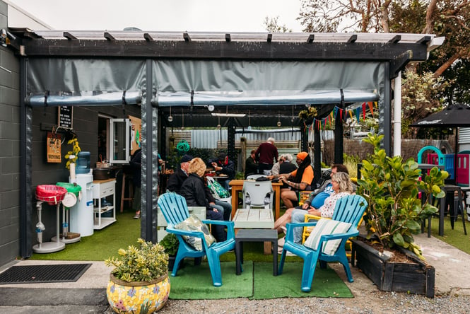 People dining outside at The Lock Up on Kapiti Coast.