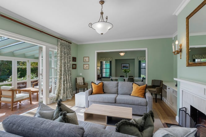 Green walls in living room area in Parkside Oasis.