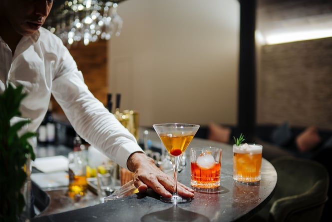 Close up of cocktails on a bar.