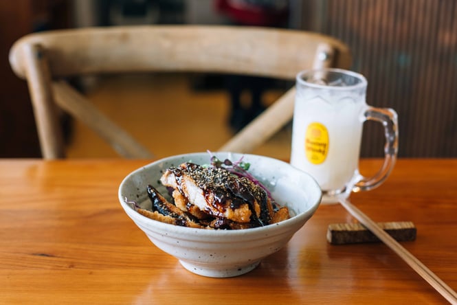 Close up of a bowl of food on a table.