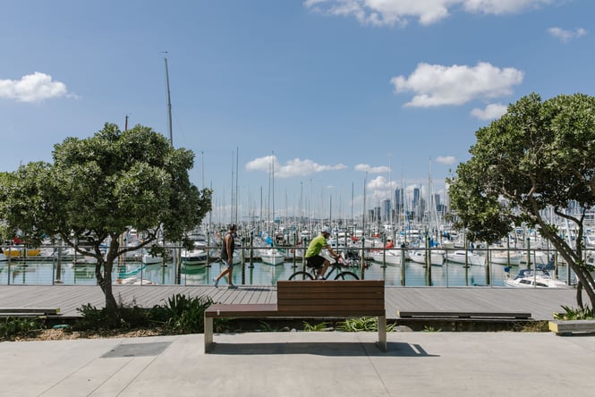 A man walking the Auckland water fornt.