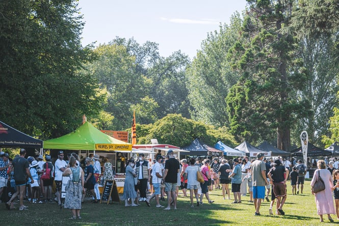 People milling about the Hawke's Bay Farmers Market on a sunny day.