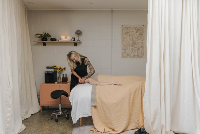 Therapist working on a customer at Face.it.