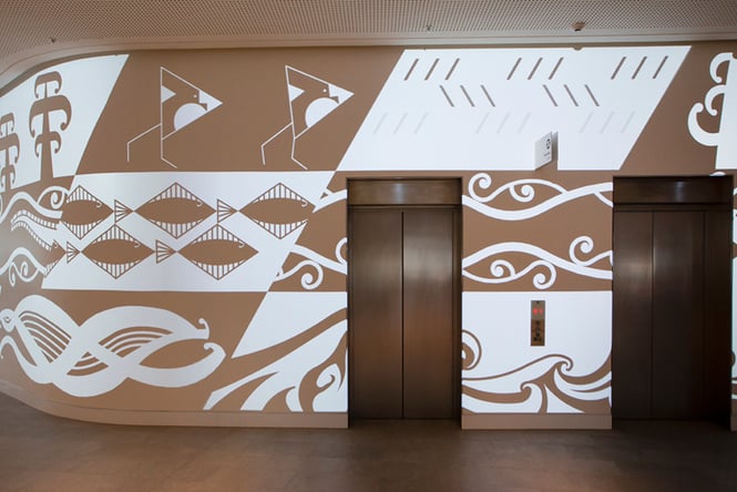 Maori artwork on a wall.