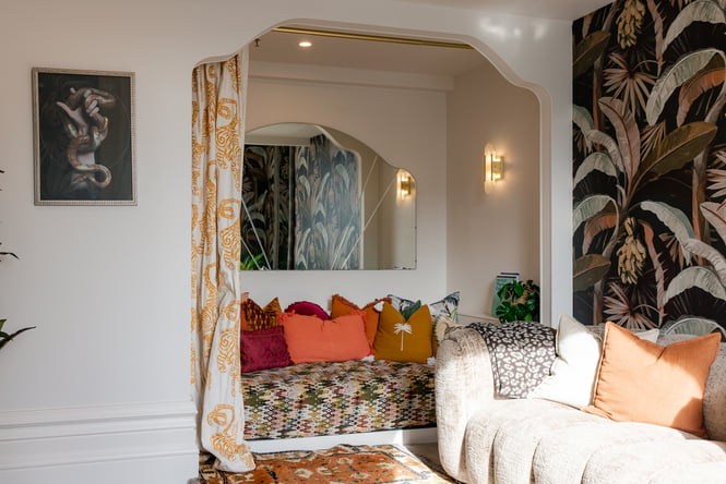 The living room, with colourful patterns in The Eve Apartment - OGB Suite.