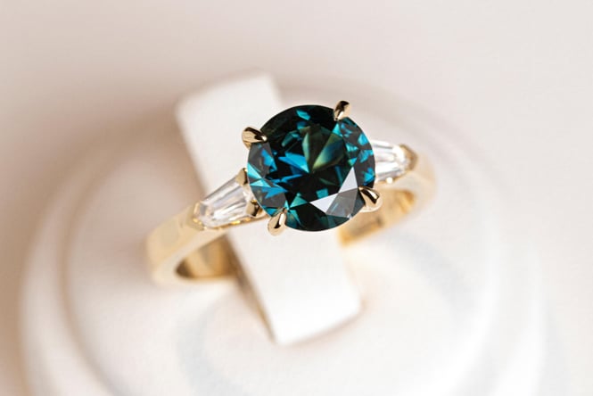 A close up of a sapphire ring.