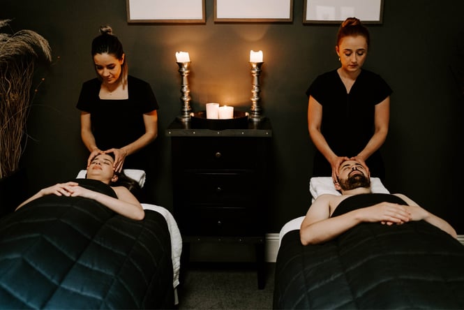 Two staff members giving massages.