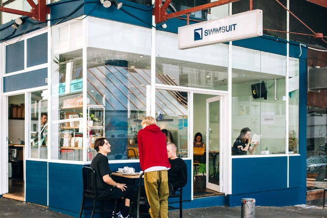 Customers sitting outside Swimsuit.