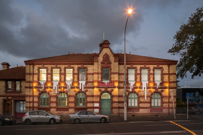 The Studio One Toi Tū building photographed at night.