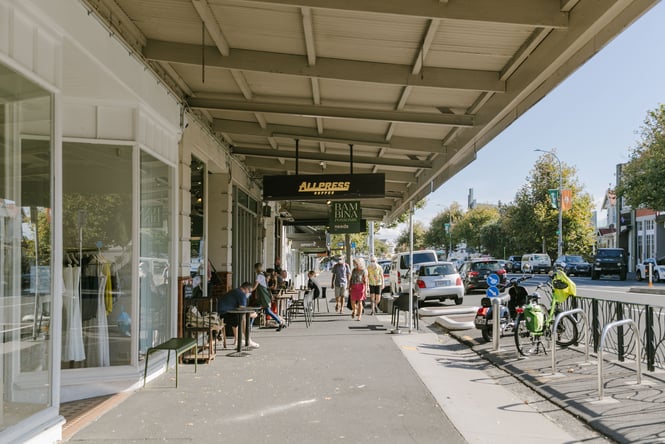 People milling about Allpress cafe on a sunny day.