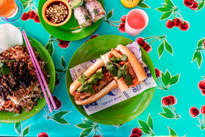 A flat lay of brightly coloured food on a table.