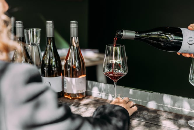 Wine being poured into a wine glass.