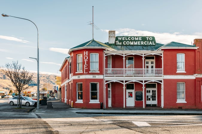 A red Roxburgh building on a sunny day.