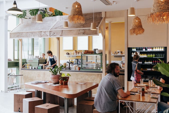 People working inside a busy cafe in Christchurch's South Town.