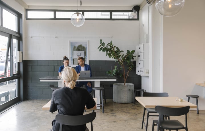 People working in a cafe.