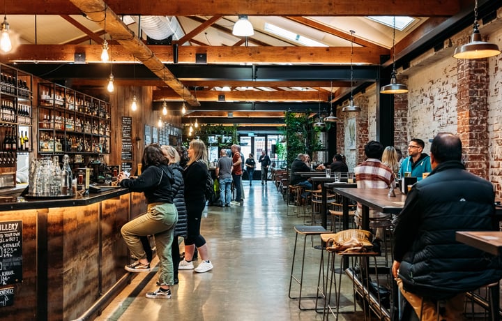 Customers at the bar at Brew Union.