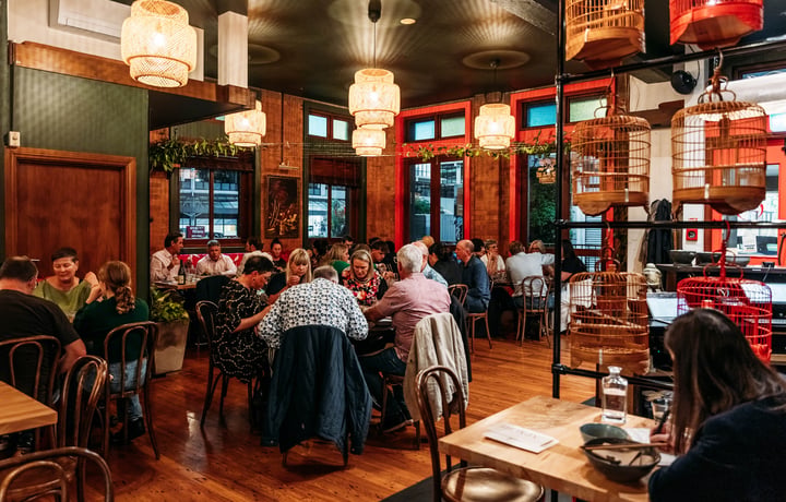 Dining room full of customers in Apache.